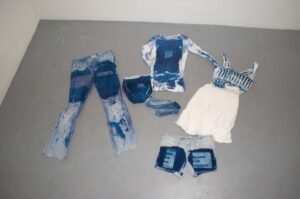 Photograph of Cyanotype clothing laying on the floor