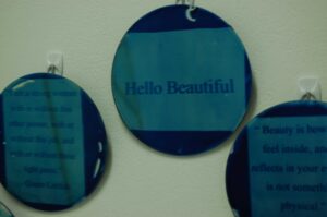 A photograph of cyanotype mirrors with positive remarks